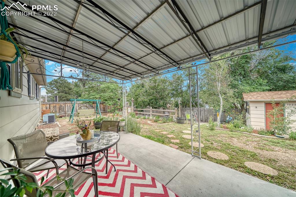 7035 Chippewa Road Colorado Springs, CO 80915 - Photo 6 of 22 a house view with a sitting space and garden view