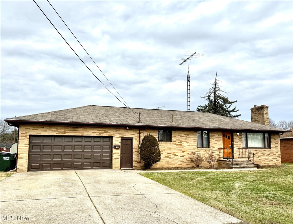 4531 8th Street Northwest Canton, OH 44708 - Photo 1 of 19 Ranch-style home featuring a garage and a front yard