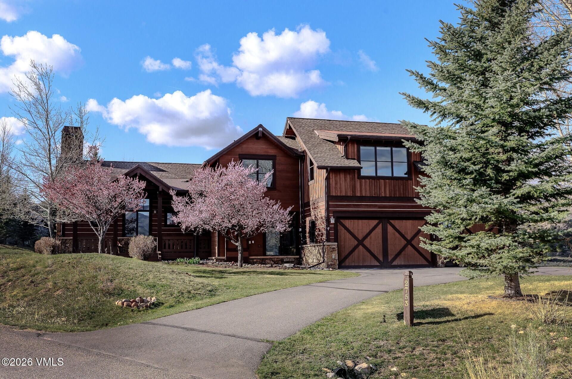 2753 East Haystacker Drive Eagle, CO 81631 - Photo 1 of 41 a front view of a house with garden