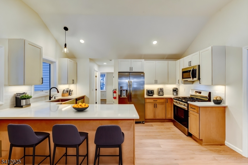 39 Old Road Ringwood, NJ 07456 - Photo 11 of 43 a kitchen with refrigerator a stove and chairs
