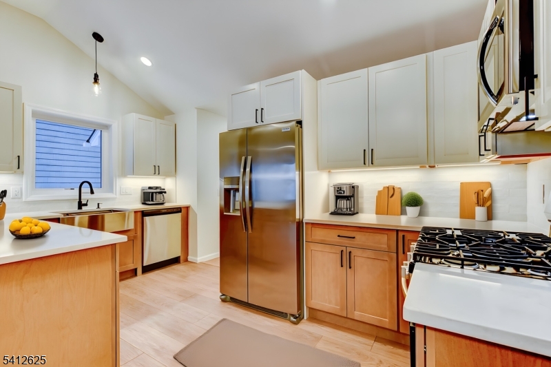 39 Old Road Ringwood, NJ 07456 - Photo 12 of 43 a kitchen with stainless steel appliances granite countertop a sink stove and refrigerator