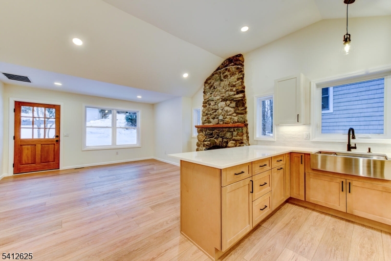 39 Old Road Ringwood, NJ 07456 - Photo 14 of 43 a kitchen with stainless steel appliances granite countertop a sink cabinets and wooden floor