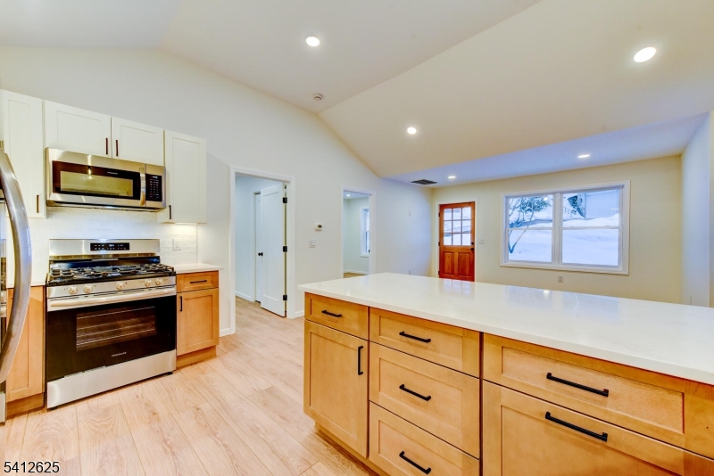 39 Old Road Ringwood, NJ 07456 - Photo 15 of 43 a kitchen with stainless steel appliances granite countertop a stove a sink and a microwave