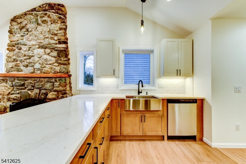 39 Old Road Ringwood, NJ 07456 - Photo 17 of 43 a view of a kitchen with wooden floor and a sink