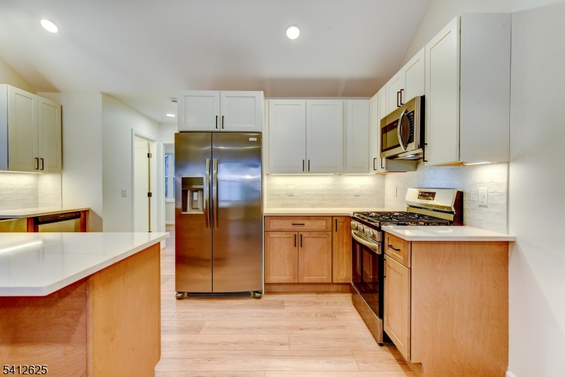 39 Old Road Ringwood, NJ 07456 - Photo 19 of 43 a kitchen with stainless steel appliances granite countertop a refrigerator stove and sink
