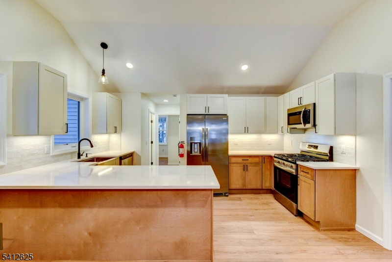 39 Old Road Ringwood, NJ 07456 - Photo 20 of 43 a large kitchen with cabinets and stainless steel appliances