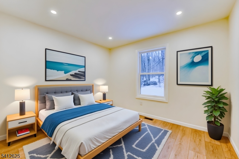 39 Old Road Ringwood, NJ 07456 - Photo 24 of 43 a bedroom with bed and paintings on the wall