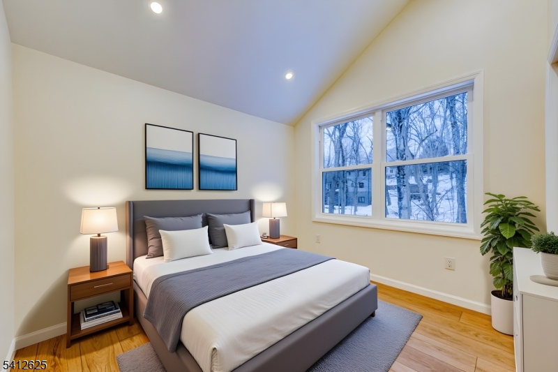 39 Old Road Ringwood, NJ 07456 - Photo 29 of 43 a bedroom with a large bed and a window