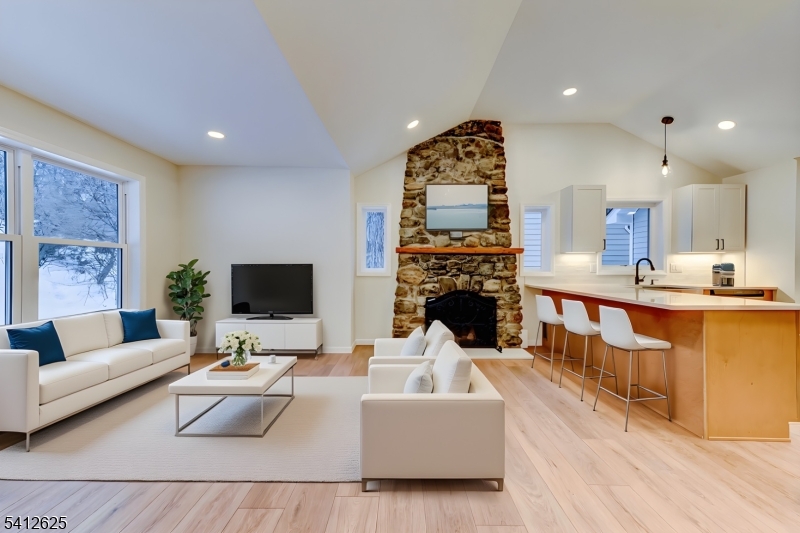 39 Old Road Ringwood, NJ 07456 - Photo 5 of 43 a living room with fireplace furniture and a flat screen tv