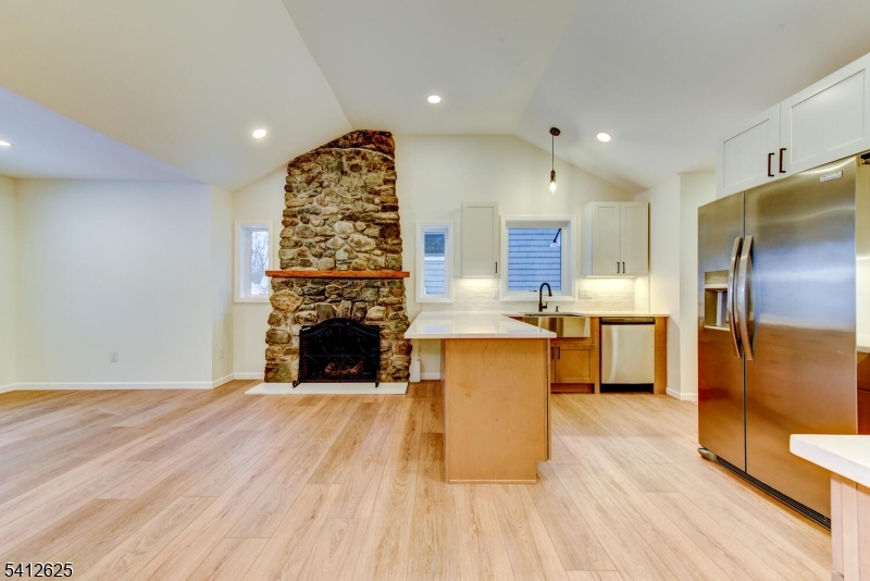 39 Old Road Ringwood, NJ 07456 - Photo 10 of 43 a open kitchen with kitchen island a counter top space a sink stainless steel appliances and cabinets