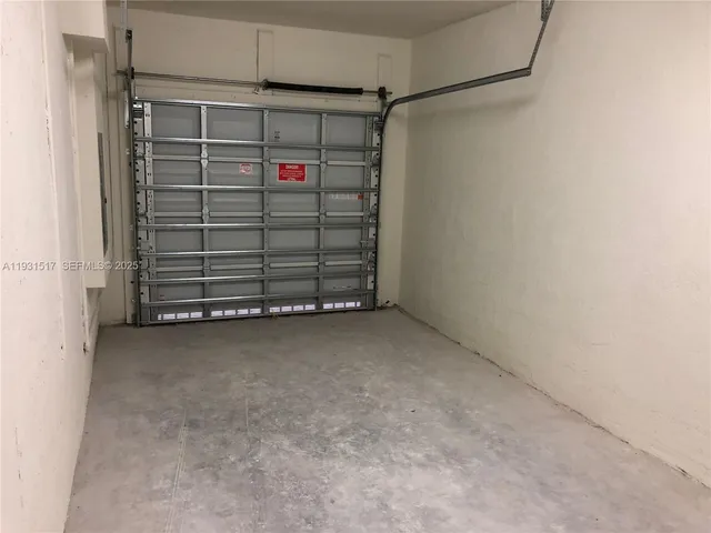 an empty room with closet area