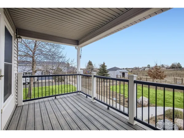 a view of balcony with wooden floor