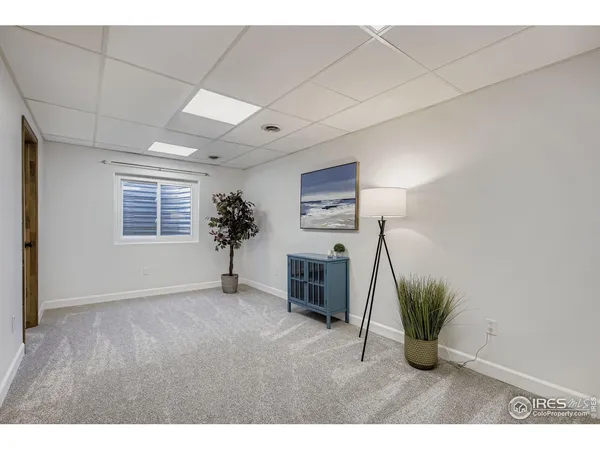 a view of livingroom with furniture and a potted plant
