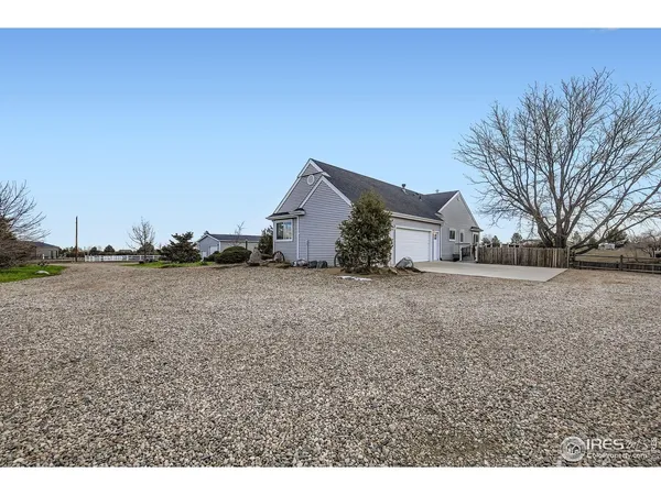 a view of large house with a yard