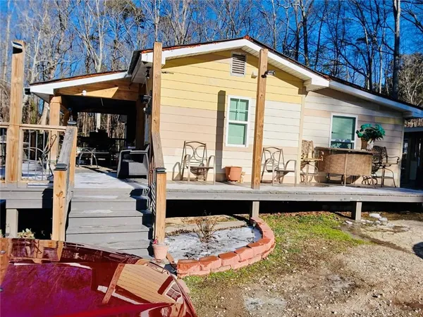 a front view of house with outdoor seating