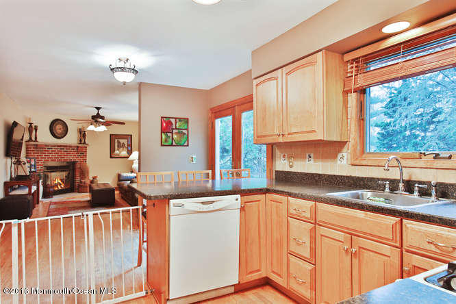 476 Diamond Road Jackson, NJ 08527 - Photo 14 of 37 a kitchen with granite countertop a sink cabinets and window