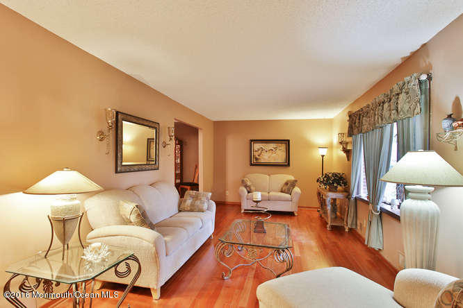 476 Diamond Road Jackson, NJ 08527 - Photo 18 of 37 a living room with furniture and a lamp
