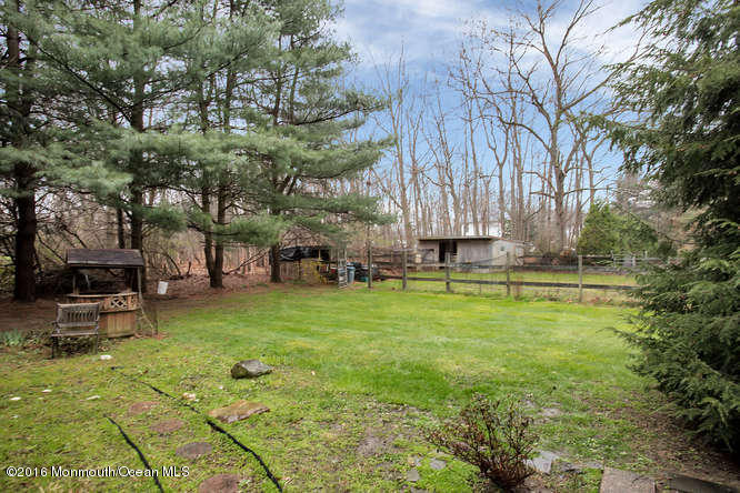 476 Diamond Road Jackson, NJ 08527 - Photo 31 of 37 a view of a backyard with lawn chairs and a large tree