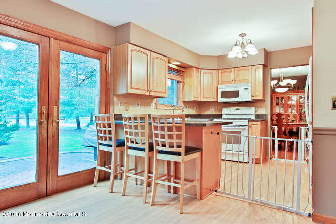 476 Diamond Road Jackson, NJ 08527 - Photo 10 of 37 a view of a dining room with chairs and chandelier