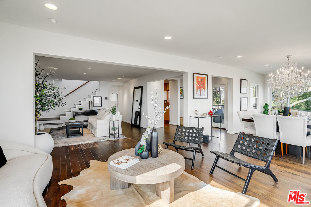 8912 Appian Way Los Angeles, CA 90046 - Photo 12 of 55 a living room with furniture kitchen view and a table