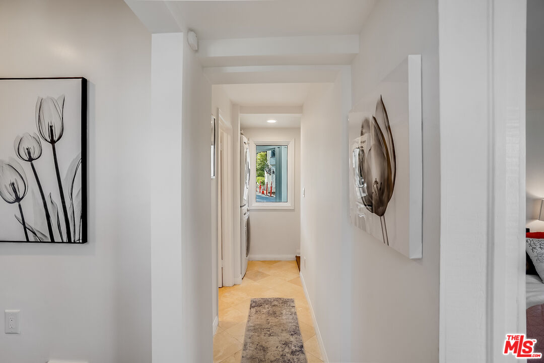 8912 Appian Way Los Angeles, CA 90046 - Photo 21 of 55 a view of a hallway with washer and dryer