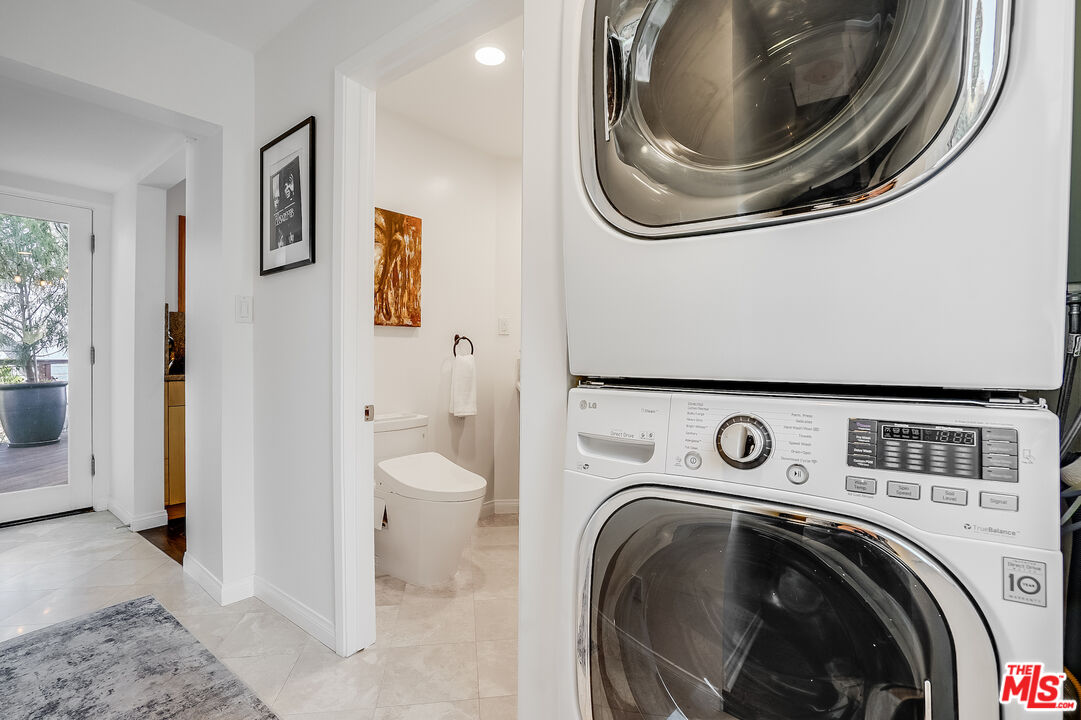 8912 Appian Way Los Angeles, CA 90046 - Photo 26 of 55 a utility room with dryer and washer