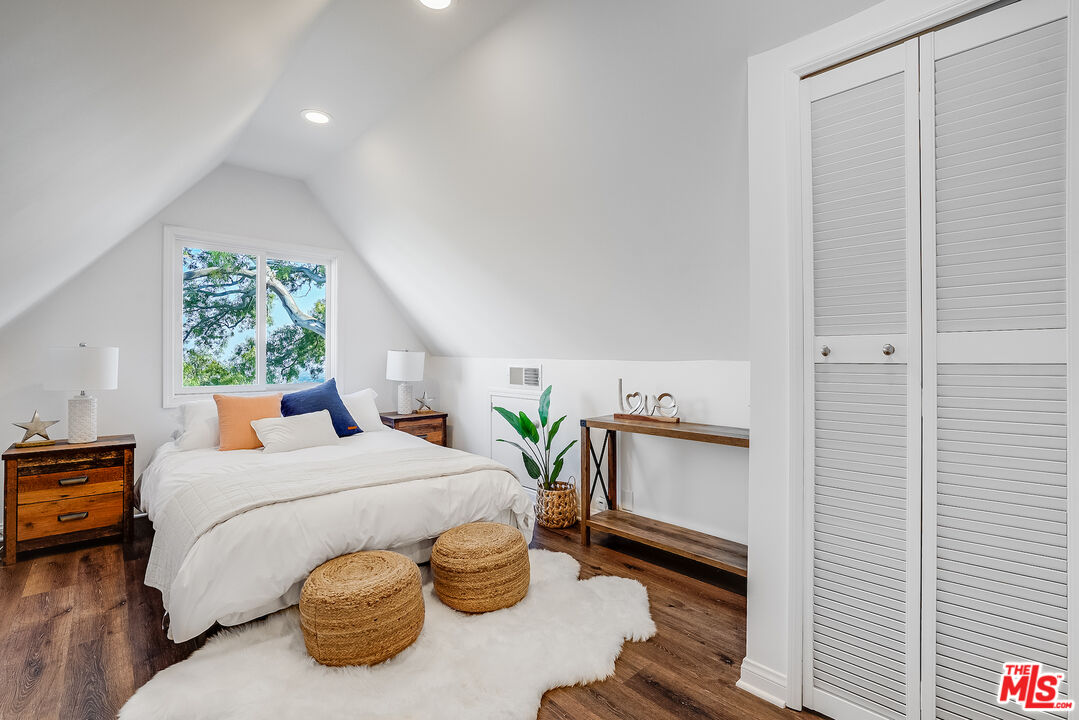 8912 Appian Way Los Angeles, CA 90046 - Photo 29 of 55 a bedroom with a bed and a window