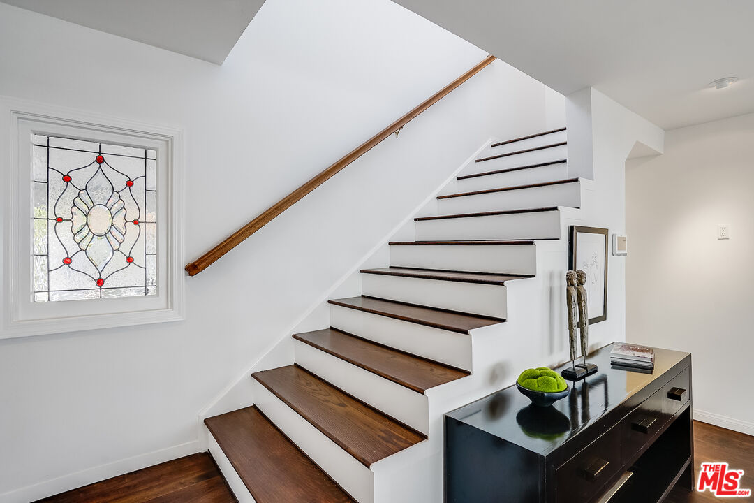 8912 Appian Way Los Angeles, CA 90046 - Photo 32 of 55 a living room with wooden floor and a potted plant