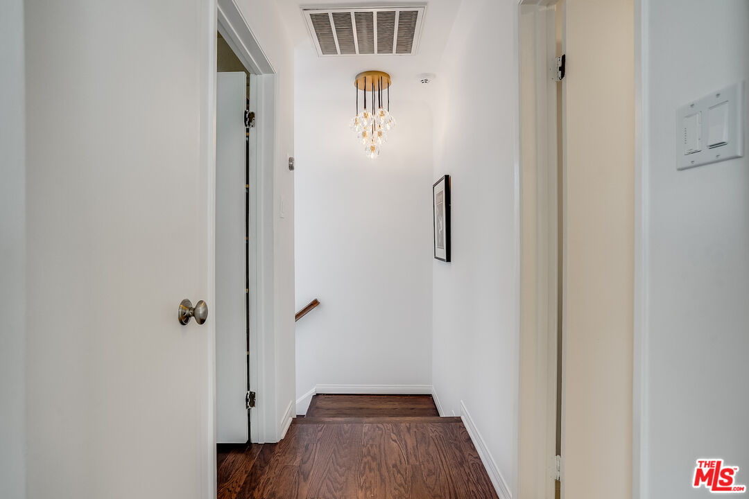 8912 Appian Way Los Angeles, CA 90046 - Photo 33 of 55 a view of a hallway with wooden floor and closet