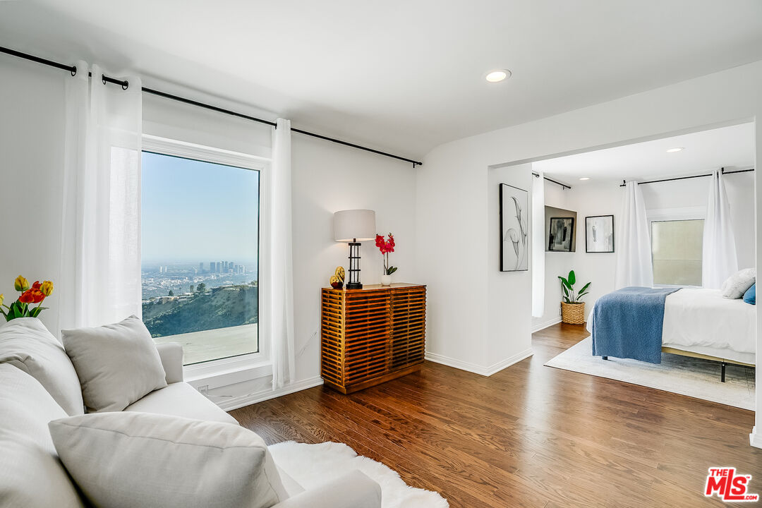 8912 Appian Way Los Angeles, CA 90046 - Photo 40 of 55 a living room with furniture and wooden floor