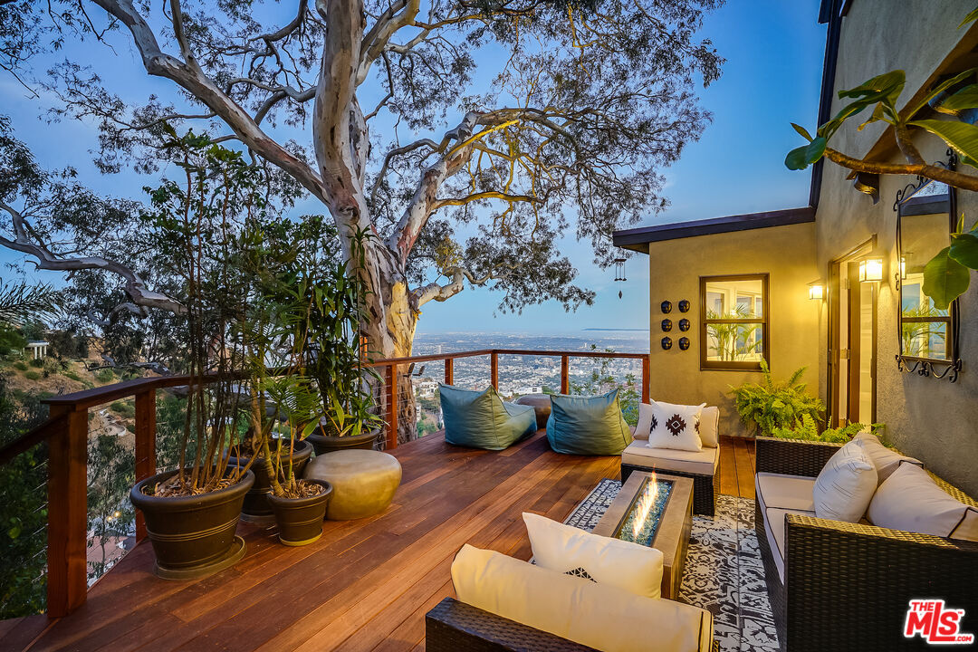 8912 Appian Way Los Angeles, CA 90046 - Photo 54 of 55 a outdoor living space with furniture and a potted plant