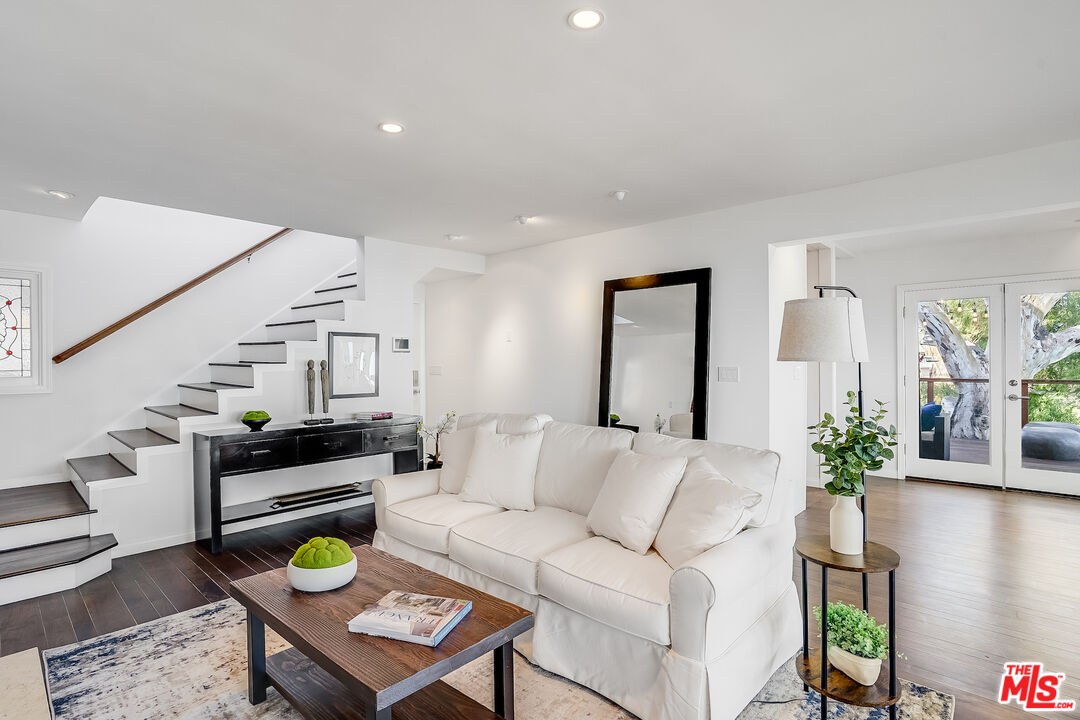 8912 Appian Way Los Angeles, CA 90046 - Photo 7 of 55 a living room with furniture and wooden floor