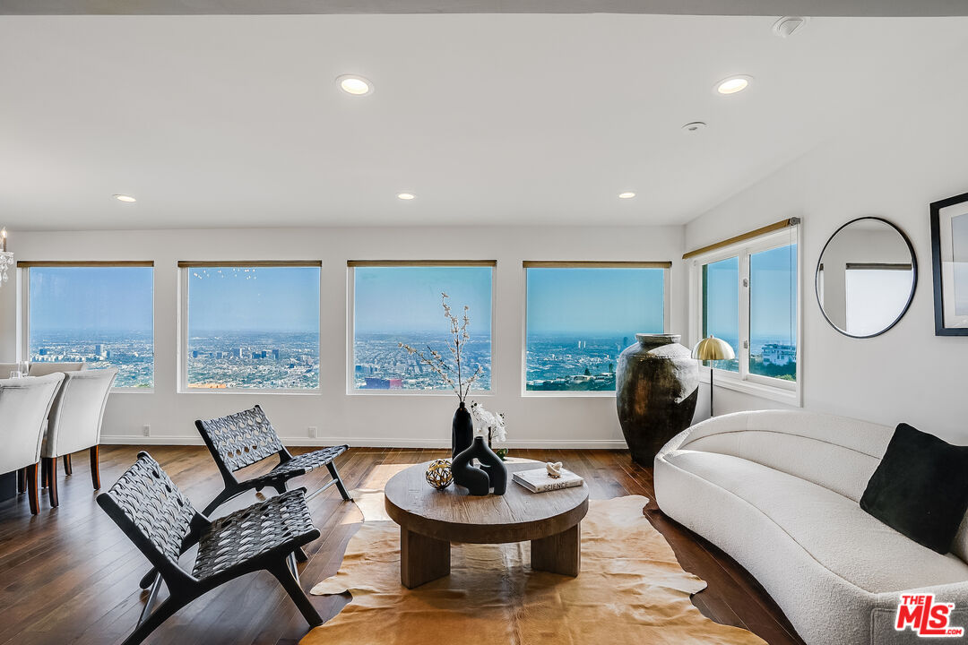 8912 Appian Way Los Angeles, CA 90046 - Photo 8 of 55 a living room with furniture and a large window