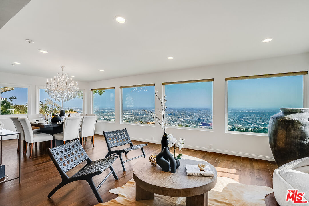 8912 Appian Way Los Angeles, CA 90046 - Photo 9 of 55 a living room with furniture and a large window
