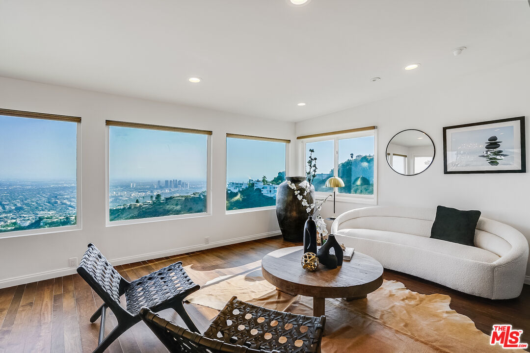 8912 Appian Way Los Angeles, CA 90046 - Photo 10 of 55 a living room with furniture and a potted plant