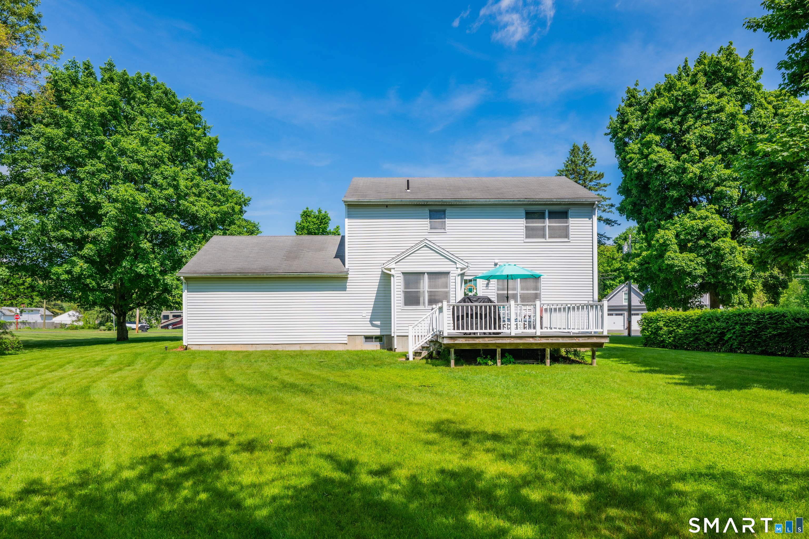 89 Windsorville Road South Windsor, CT 06074 - Photo 16 of 23 a front view of a house with a yard and trees