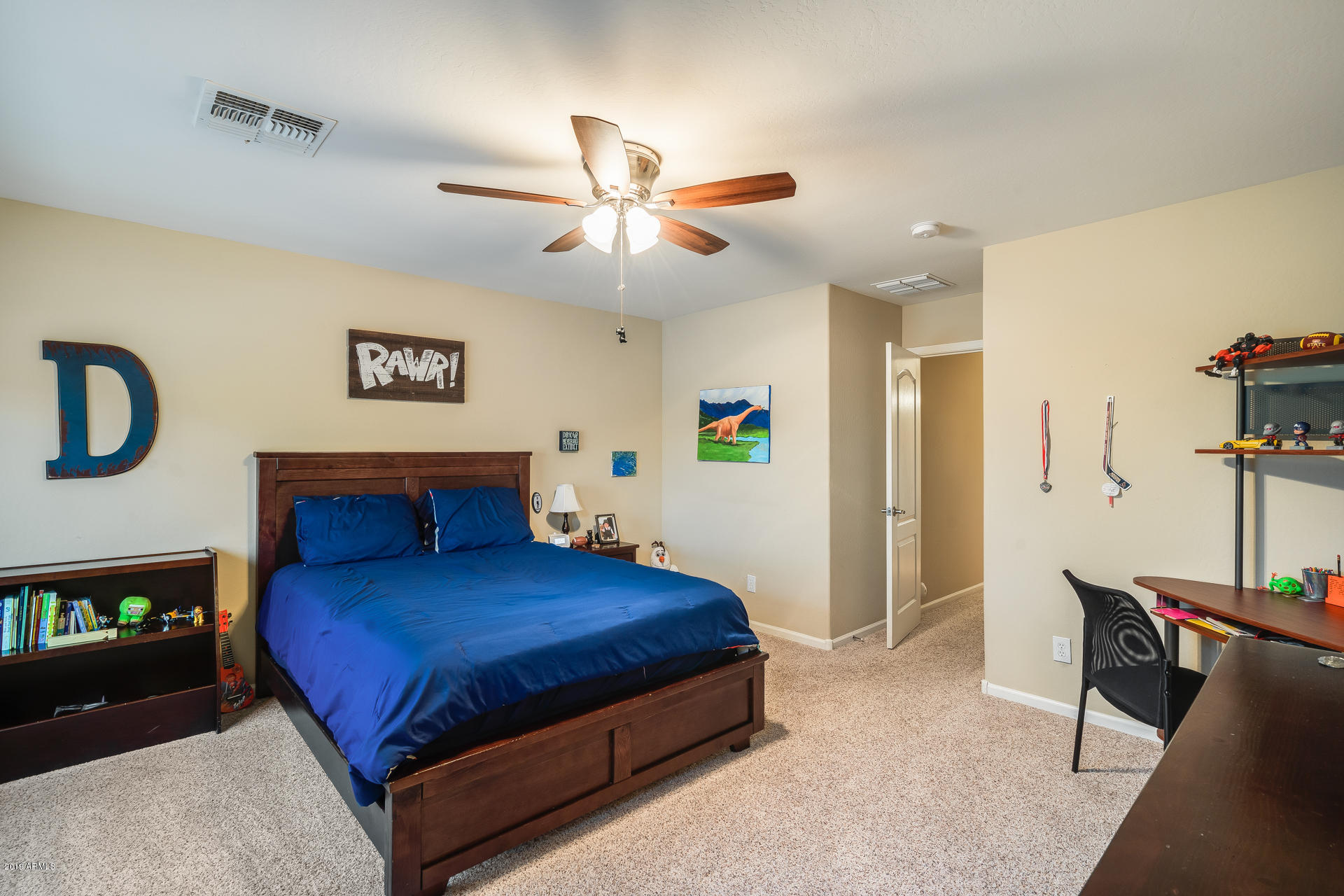 2028 West Caleb Road Phoenix, AZ 85085 - Photo 38 of 57 a bedroom with a bed and a chandelier