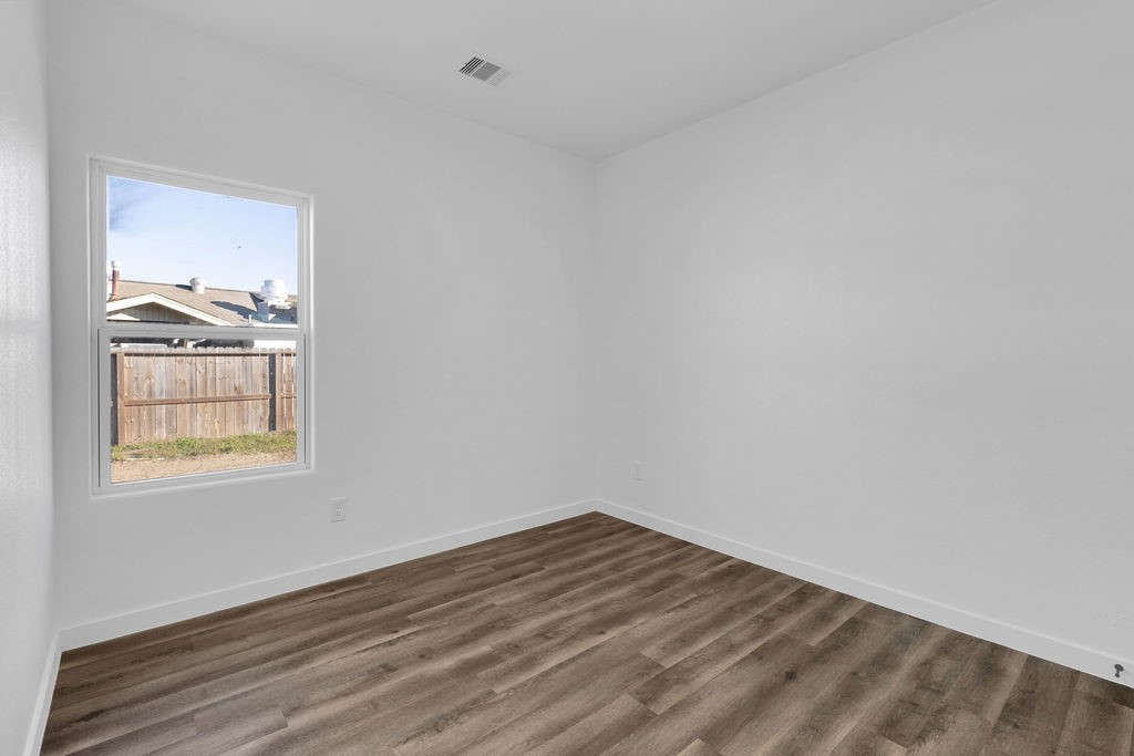 104 Runnels Street Willis, TX 77378 - Photo 17 of 27 a view of an empty room and window