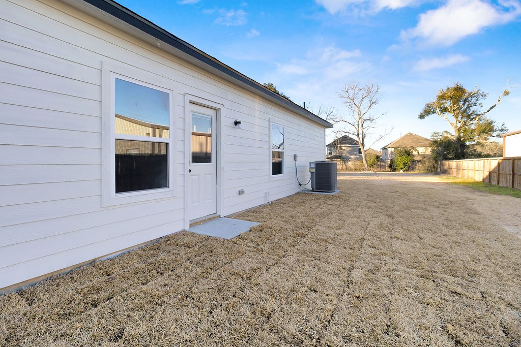 104 Runnels Street Willis, TX 77378 - Photo 26 of 27 a view of a backyard of the house