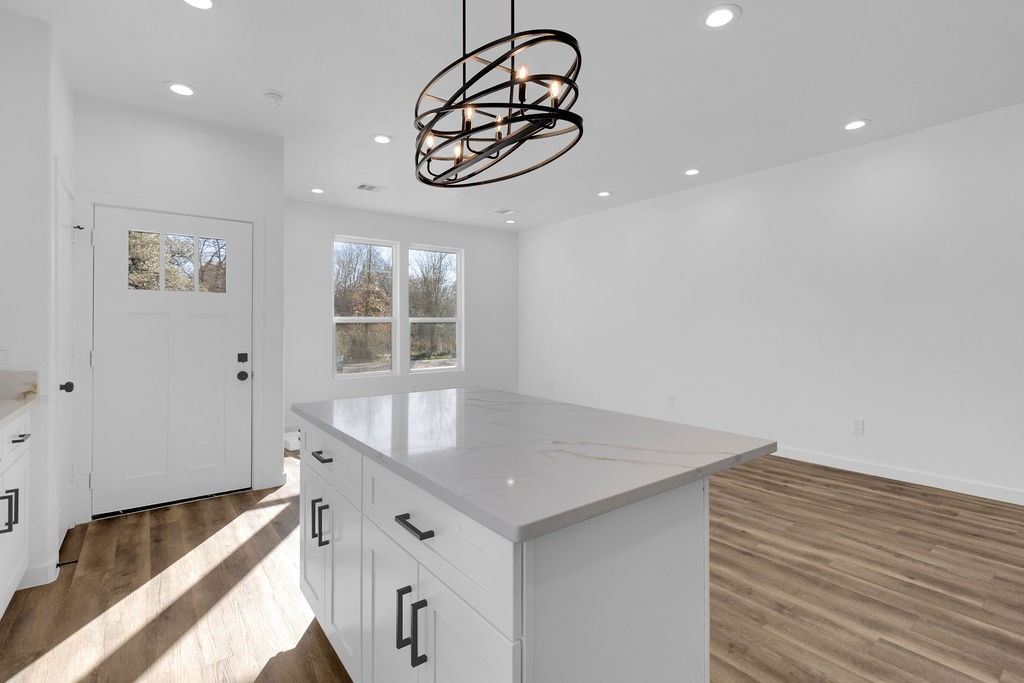 104 Runnels Street Willis, TX 77378 - Photo 9 of 27 a kitchen with stainless steel appliances granite countertop a sink and a window