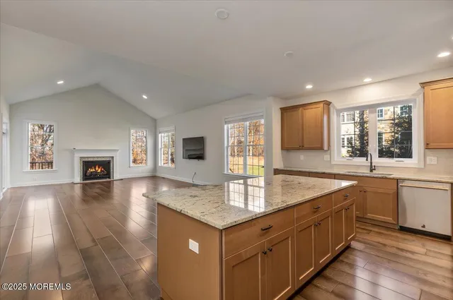 a kitchen with sink stove and microwave