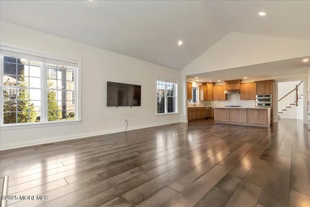 a view of a kitchen with a sink and a stove top oven