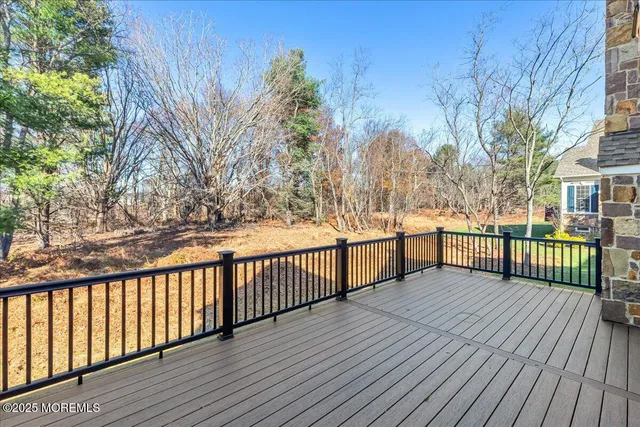 a view of a balcony with wooden floor