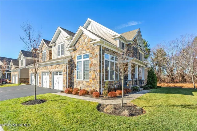 a backyard of a house with garden and plants