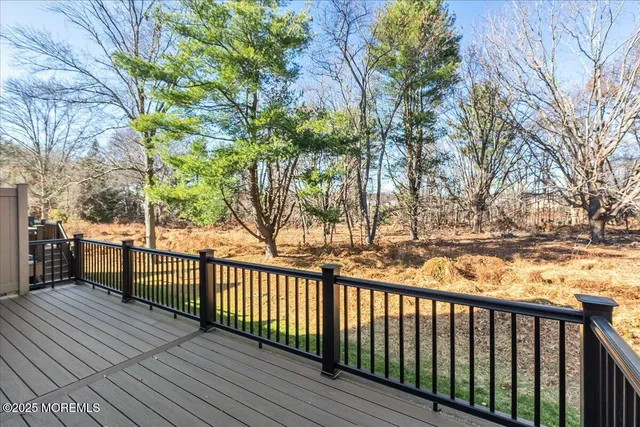 a view of a balcony with trees