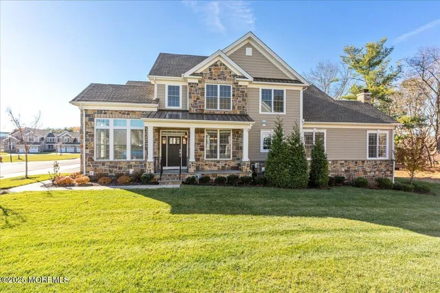 a view of a house with swimming pool and a yard
