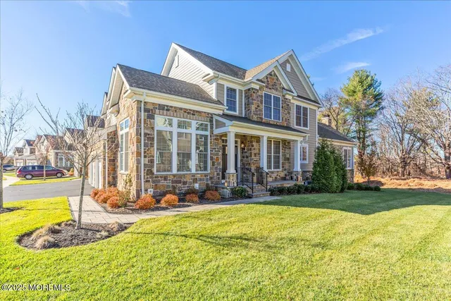 a view of a house with swimming pool and sitting area