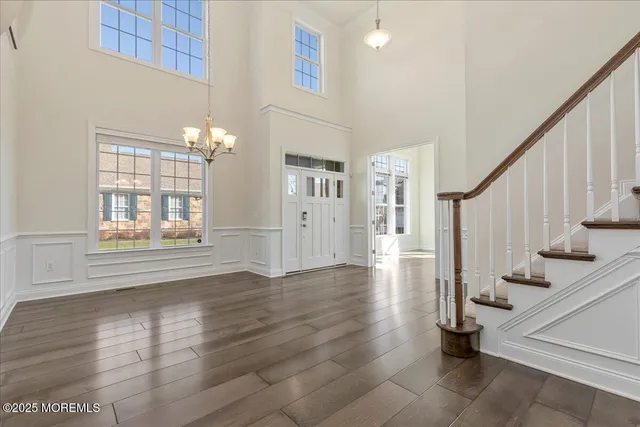 a view of an entryway with wooden floor