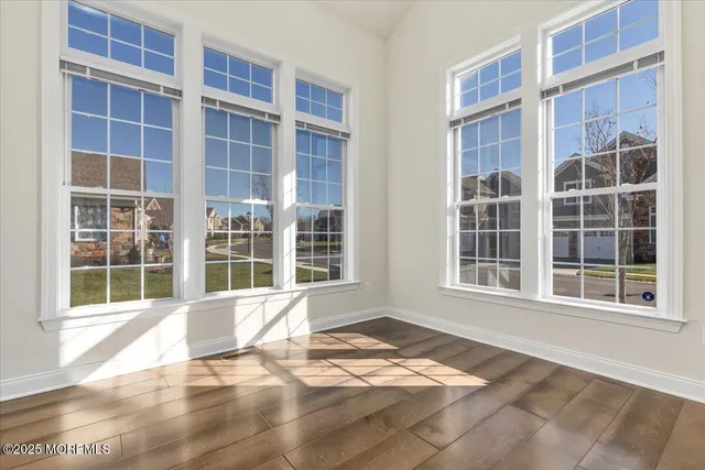 a view of empty room with windows
