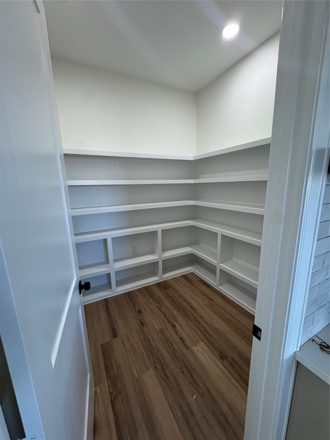 749 Wagon Wheel Trail Angleton, TX 77515 - Photo 5 of 9 a view of walk in closet with empty racks